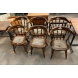 A SET OF SIX BEECH FRAMED PUB CHAIRS WITH CURVED BACKS, TURNED LEGS AND UPRIGHTS