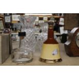 A MIXED LOT TO INCLUDE TWO GLASS VASES, A GLASS DECANTER PLUS A WADE BELL'S SCOTCH WHISKY DECANTER