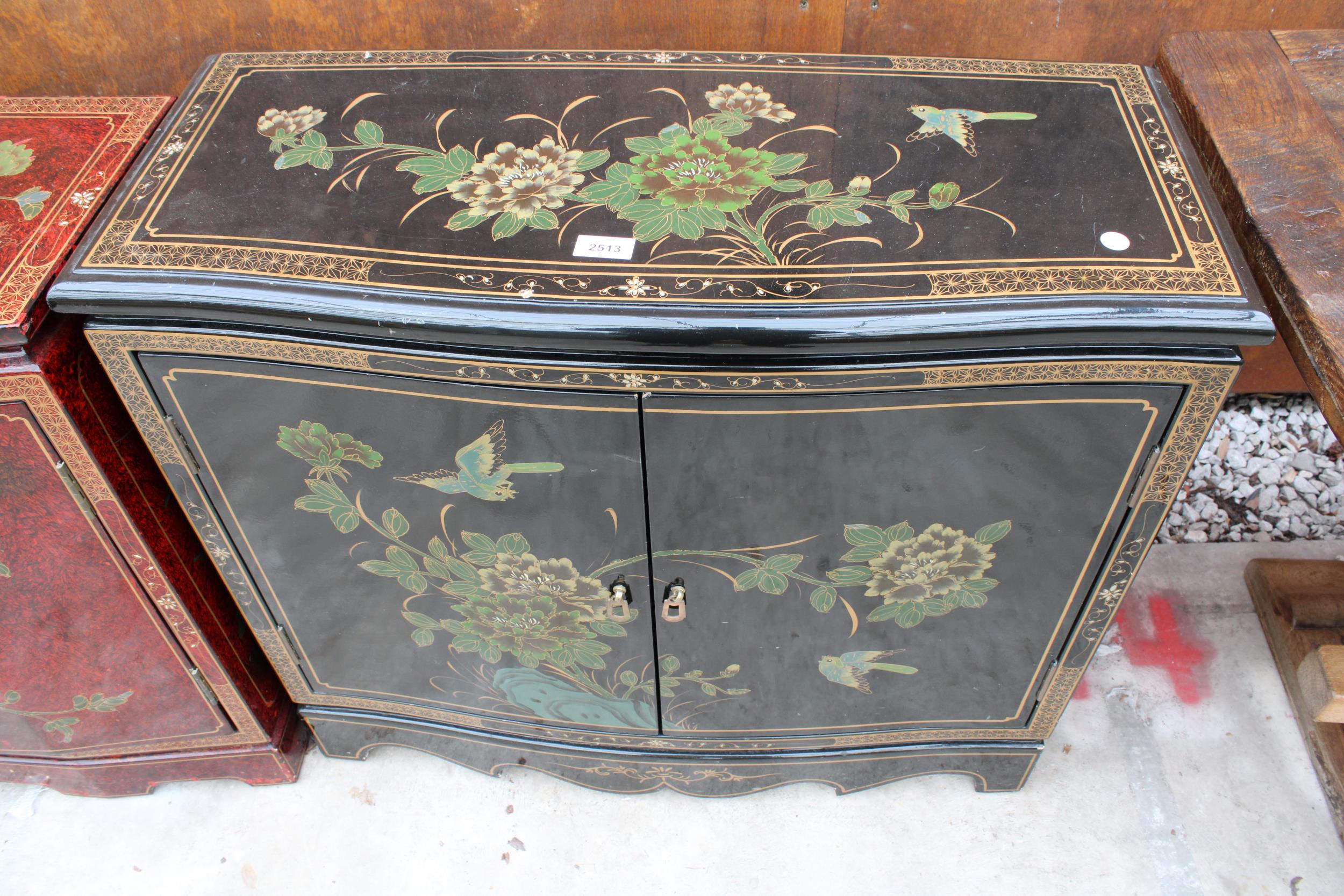 A 19TH CENTURY STYLE EBONISED TWO-DOOR SIDE CABINET WITH CHINOISERIE DECORATION, 32" WIDE