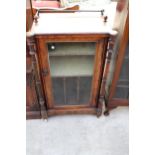 A VICTORIAN WALNUT MUSIC CABINET WITH GLASS DOOR, TURNED UPRIGHTS AND GALLERY BACK 23" WIDE