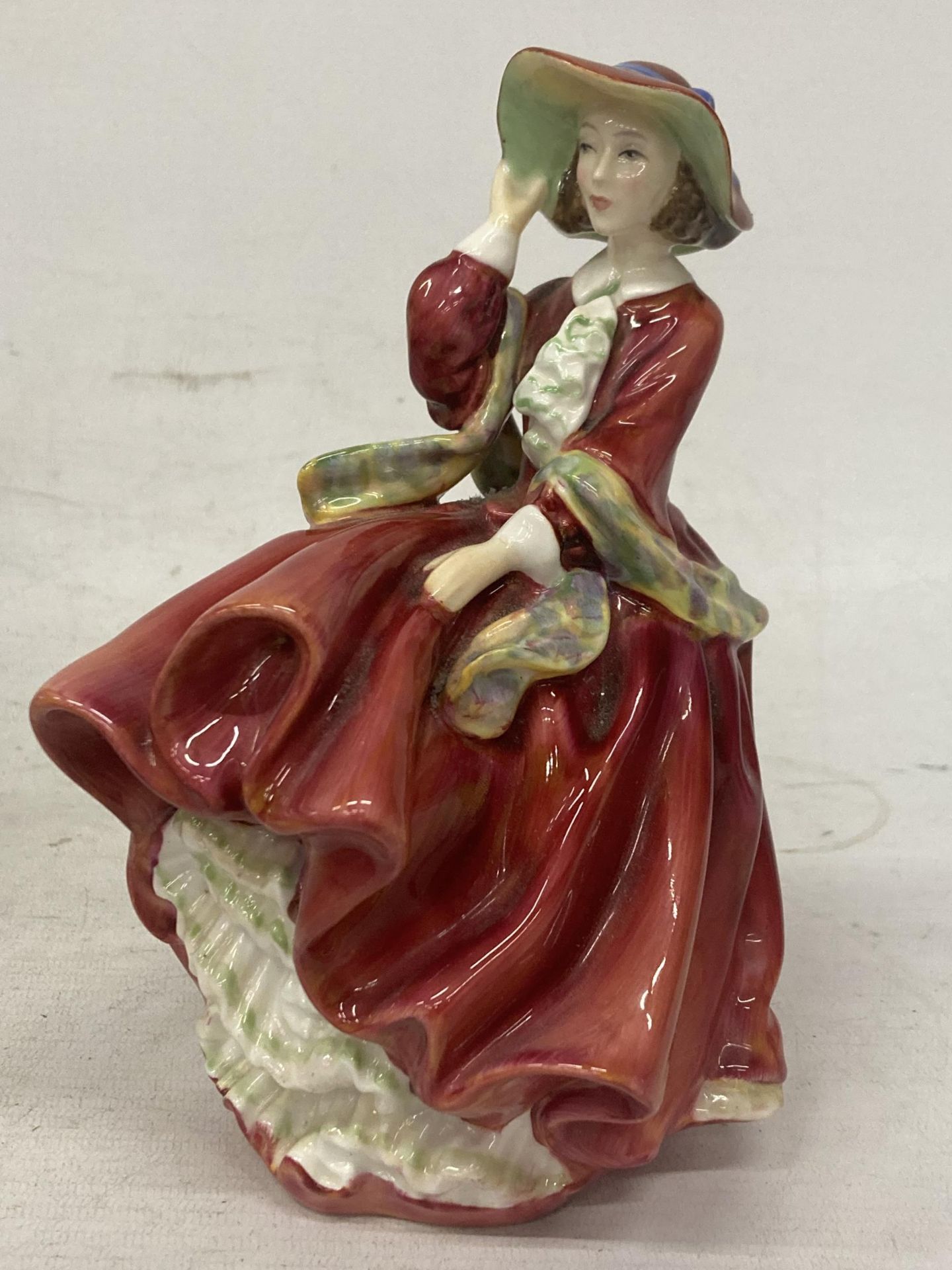 A ROYAL DOULTON FIGURINE TOP O THE HILL