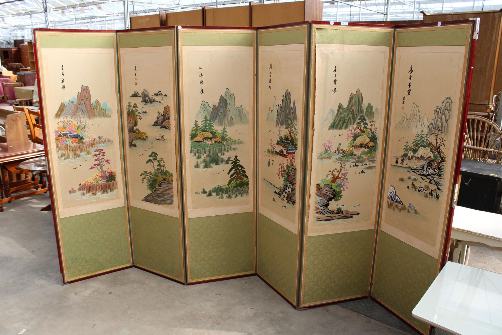 AN ORIENTAL SIX DIVISION SCREEN WITH TAPESTRY AND SILK MOUNTAIN SCENES EACH SECTION IS 60" X 18"