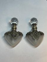 TWO GLASS PERFUME BOTTLES WITH METAL BUTTERFLY DESIGN