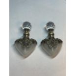 TWO GLASS PERFUME BOTTLES WITH METAL BUTTERFLY DESIGN