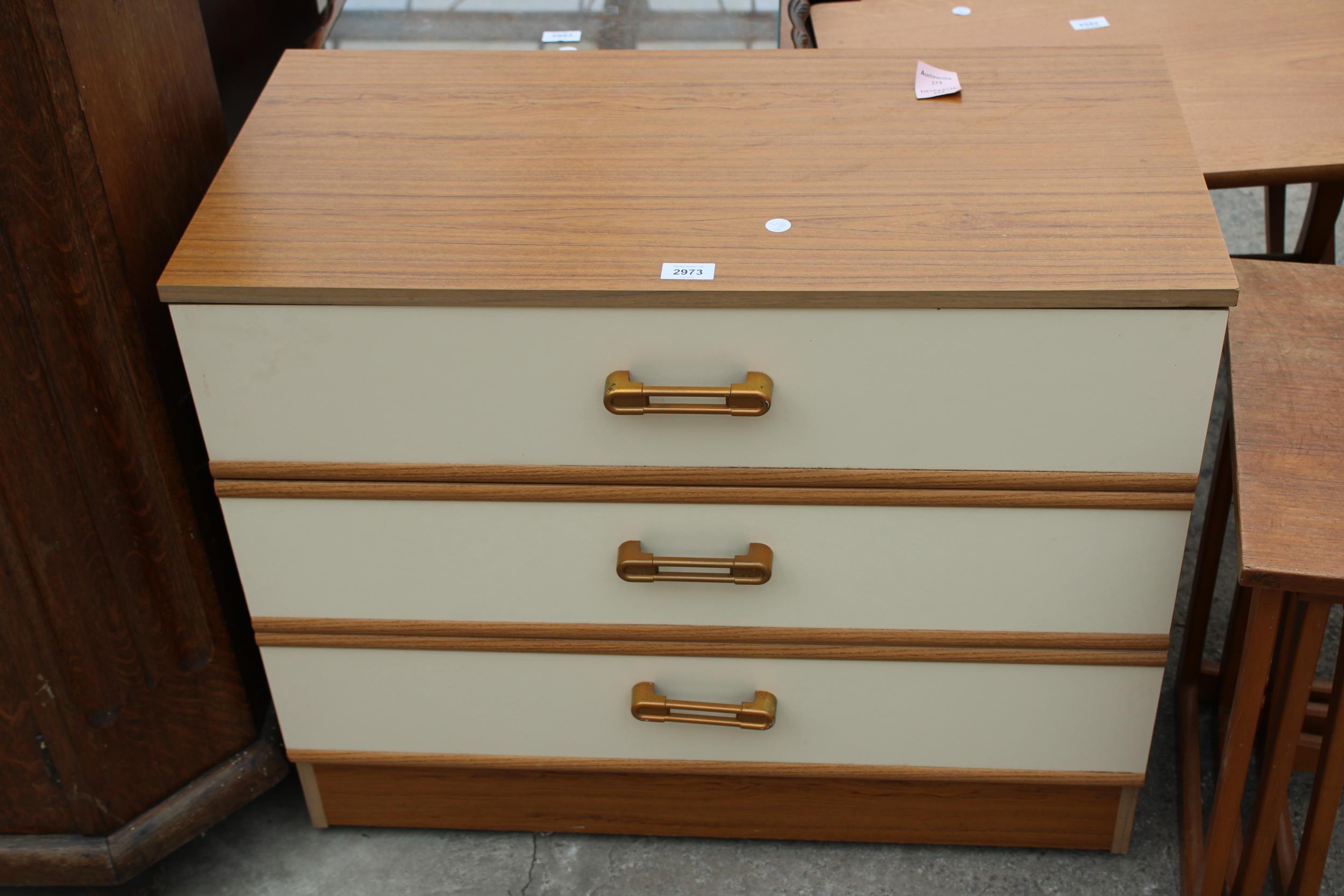 A RETRO TEAK EFFECT CHEST OF THREE DRAWERS, 31" WIDE