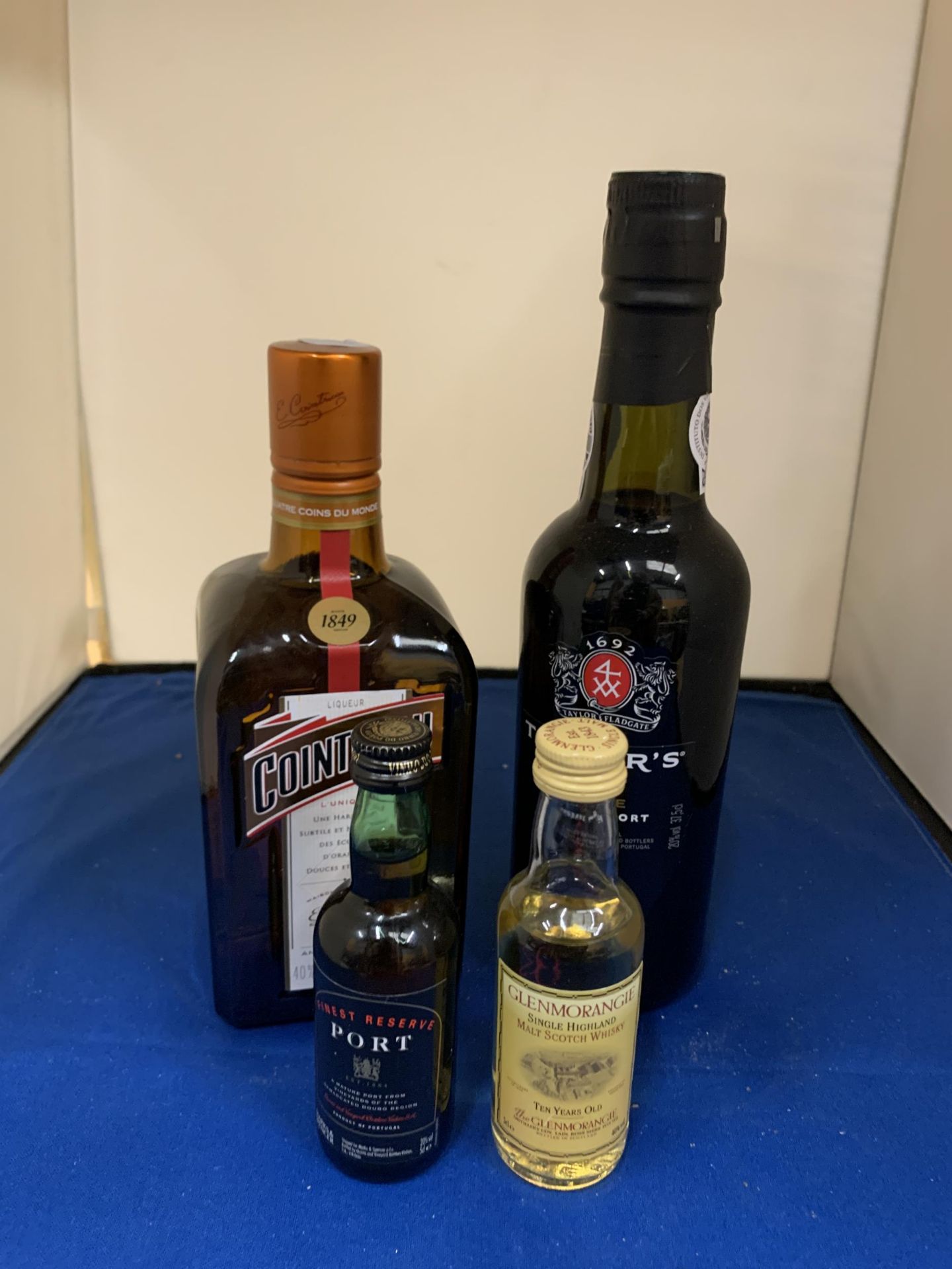 FOUR BOTTLES TO INCLUDE A HALF BOTTLE OF COINTREAU, A HALF OF TAYLORS FIRST ESTATE RESERVE PORT