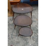 AN ERCOL NEST OF THREE PEBBLE TABLES