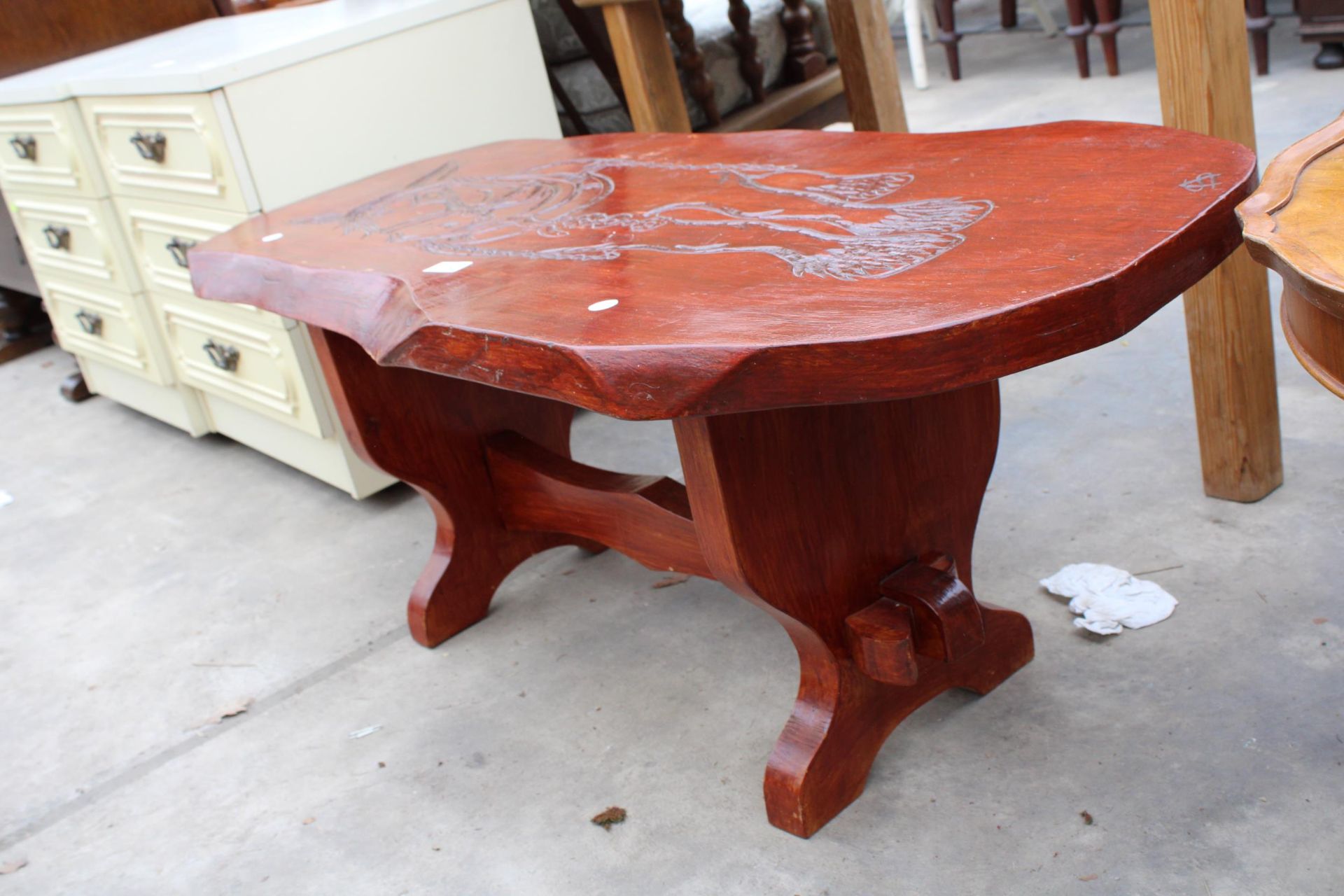 A STAINED ELM COFFEE TABLE, THE TOP HAVING CARVING OF A HORSE, SIGNED A.S, 42" X 18" - Image 3 of 3