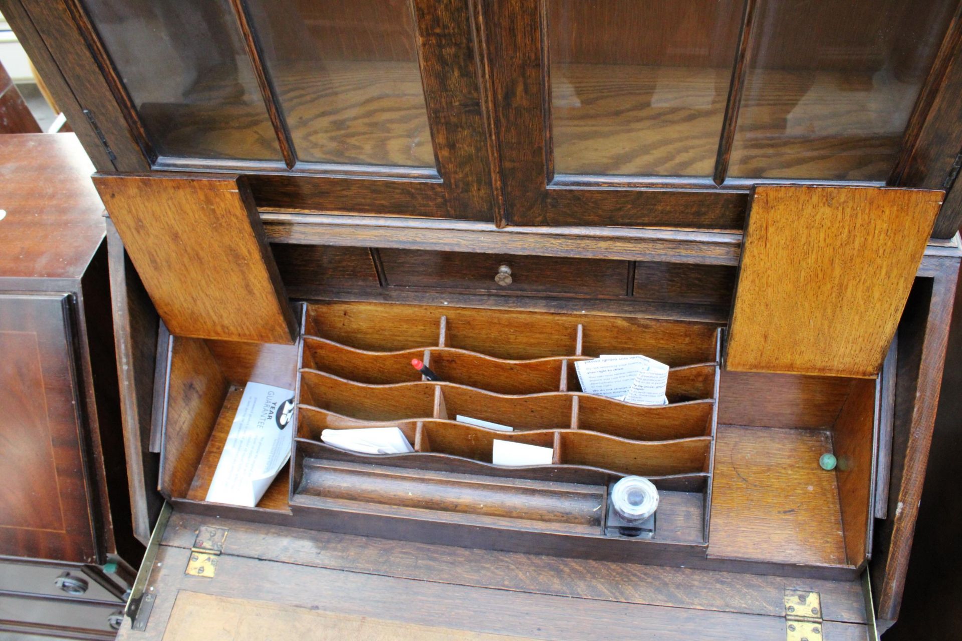 A EARLY 20TH CENTURY OAK SERPENTINE FRONTED BUREAU BOOKCASE WITH RETRACTABLE FITTED INTERIOR 29" - Image 5 of 6