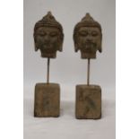 TWO BUDDAH HEADS ON STANDS