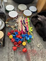 AN ASSORTMENT OF CHILDRENS MUSICAL INSTRUMENTS TO INCLUDE TAMBORINES AND CASTANETS ETC