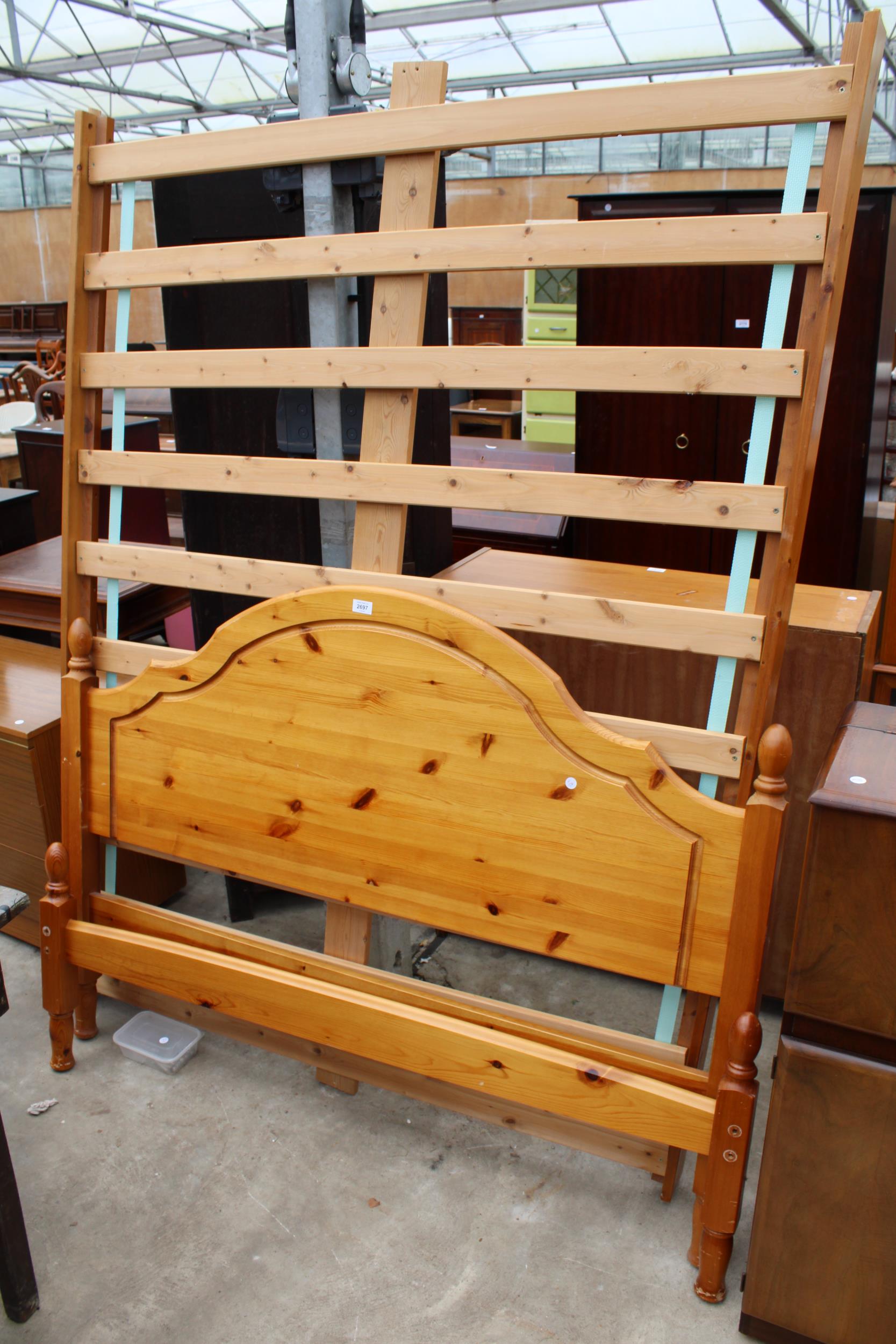 A PINE BEDSTEAD 4'6" WIDE