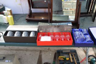 AN ASSORTMENT OF BOXED GLASS SETS TO INCLUDE CRYSTAL WINE GLASSES AND A WHISKEY DECANTOR AND GLASS