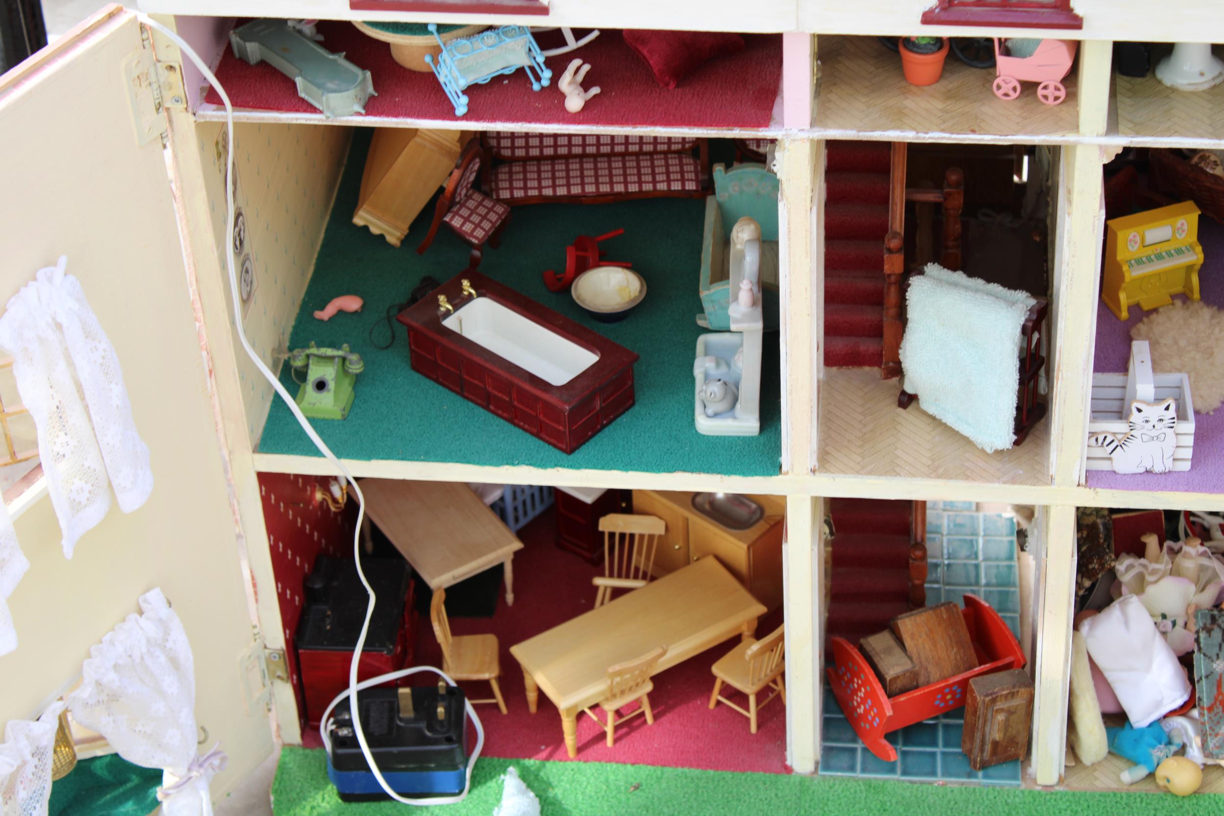 A LARGE WOODEN DOLLS HOUSE WITH A LARGE QUANTITY OF DOLLS HOUSE FURNITURE - Image 3 of 6
