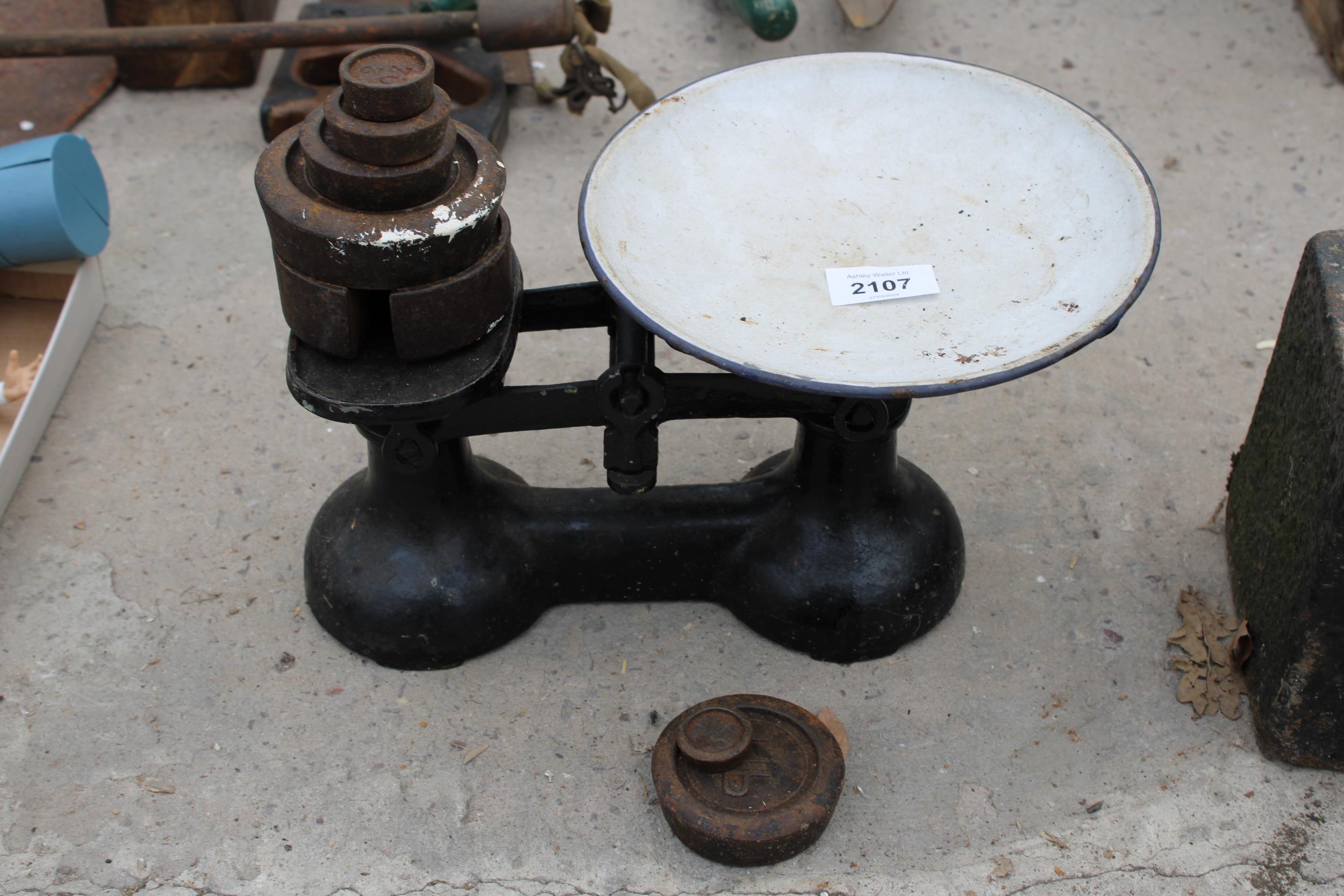 A VINTAGE SET OF BALANCE SCALES WITH WEIGHTS