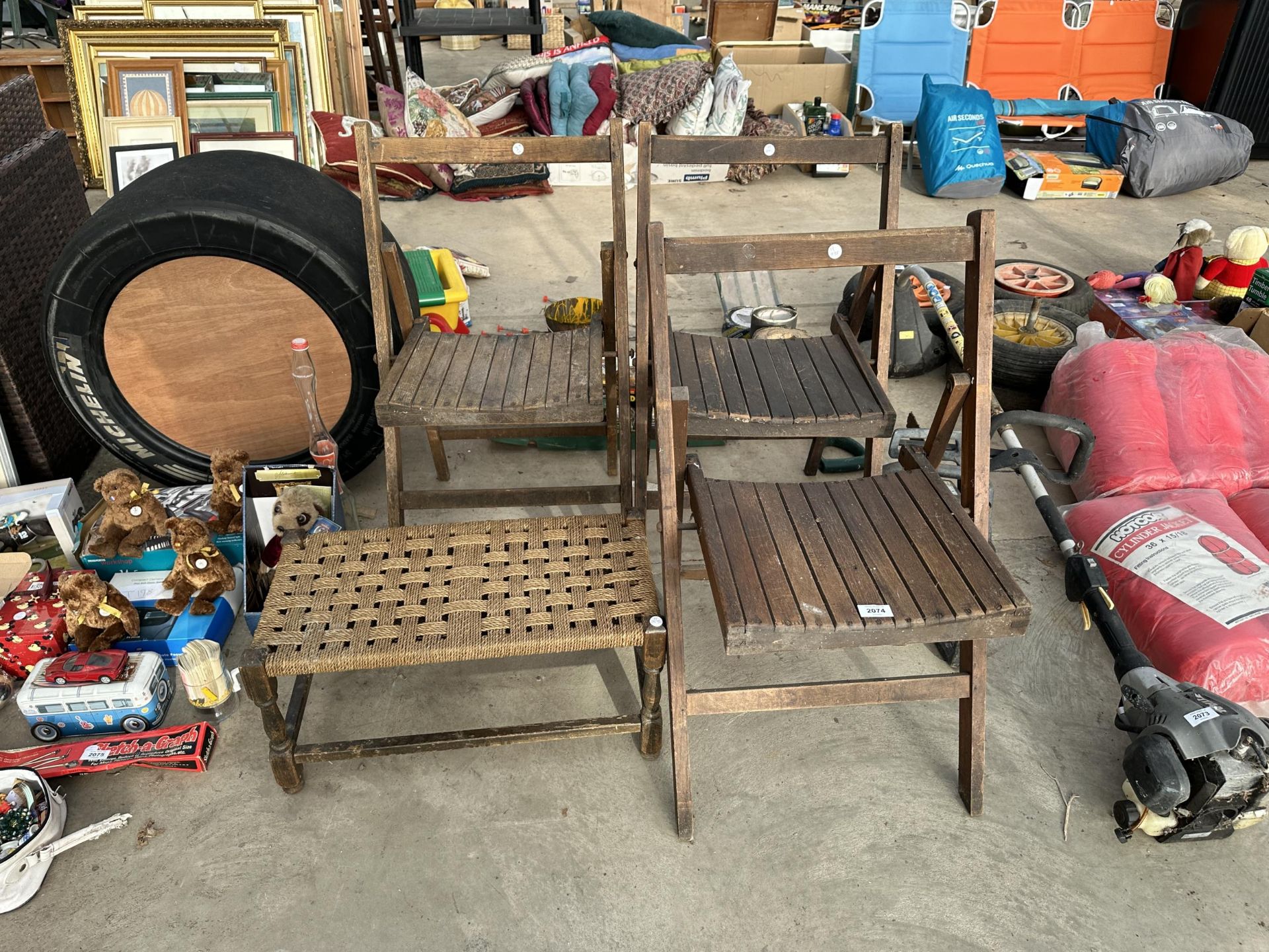 THREE WOODEN FOLDING CHAIRS AND A WOVEN TOP STOOL