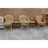 THREE WICKER AND BAMBOO ARMCHAIRS AND TWO MAGAZINE RACKS/TABLES