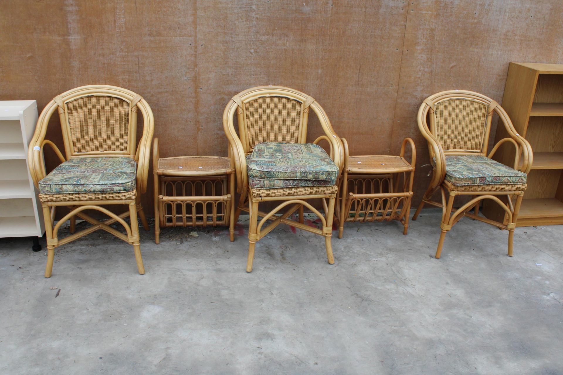 THREE WICKER AND BAMBOO ARMCHAIRS AND TWO MAGAZINE RACKS/TABLES