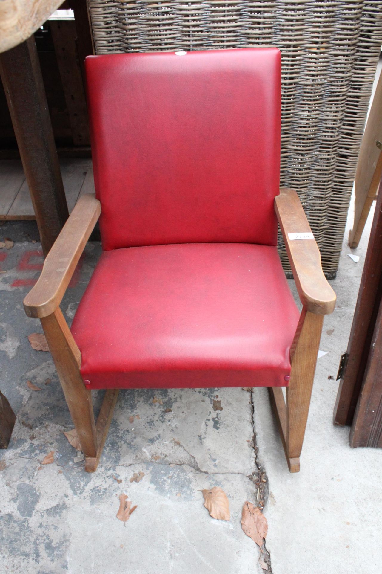 A MID 20TH CENTURY CHIDS ROCKING CHAIR