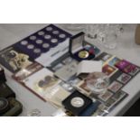 A COLLECTION OF STAMPS, COINS, A PIN AND A PAPERWEIGHT TO INCLUDE 25TH ANNIVERSERY COINS OF QUEEN