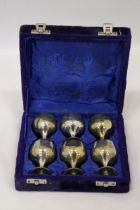 A SET OF SIX SMALL SILVER PLATED GOBLETS IN A PRESENTATION CASE