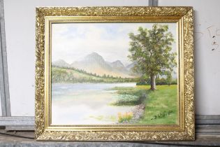 AN OIL ON CANVAS PAINTING OF LOWESWATER IN THE LAKE DISTRICT IN A GILT FRAME, SIGNED D W SMITH, 60CM