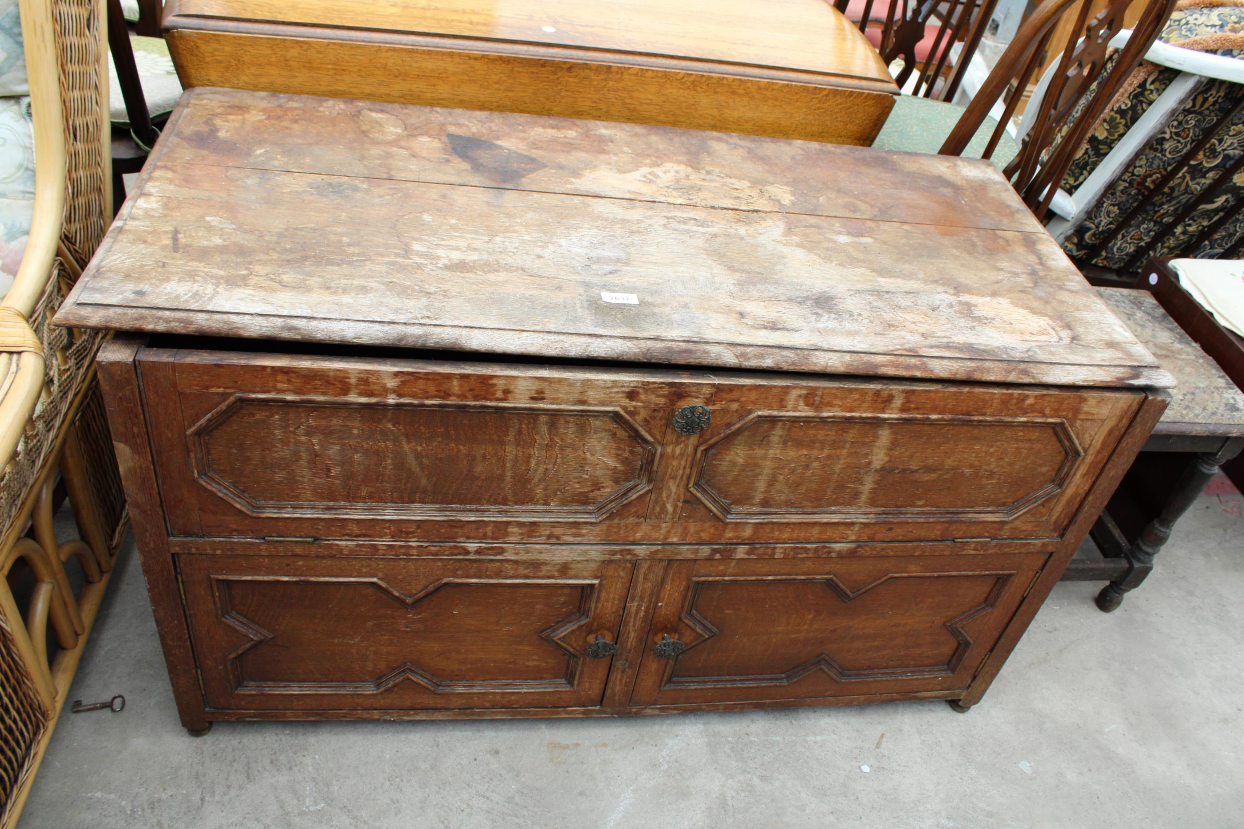 A MID 20TH CENTURY OAK CABINET