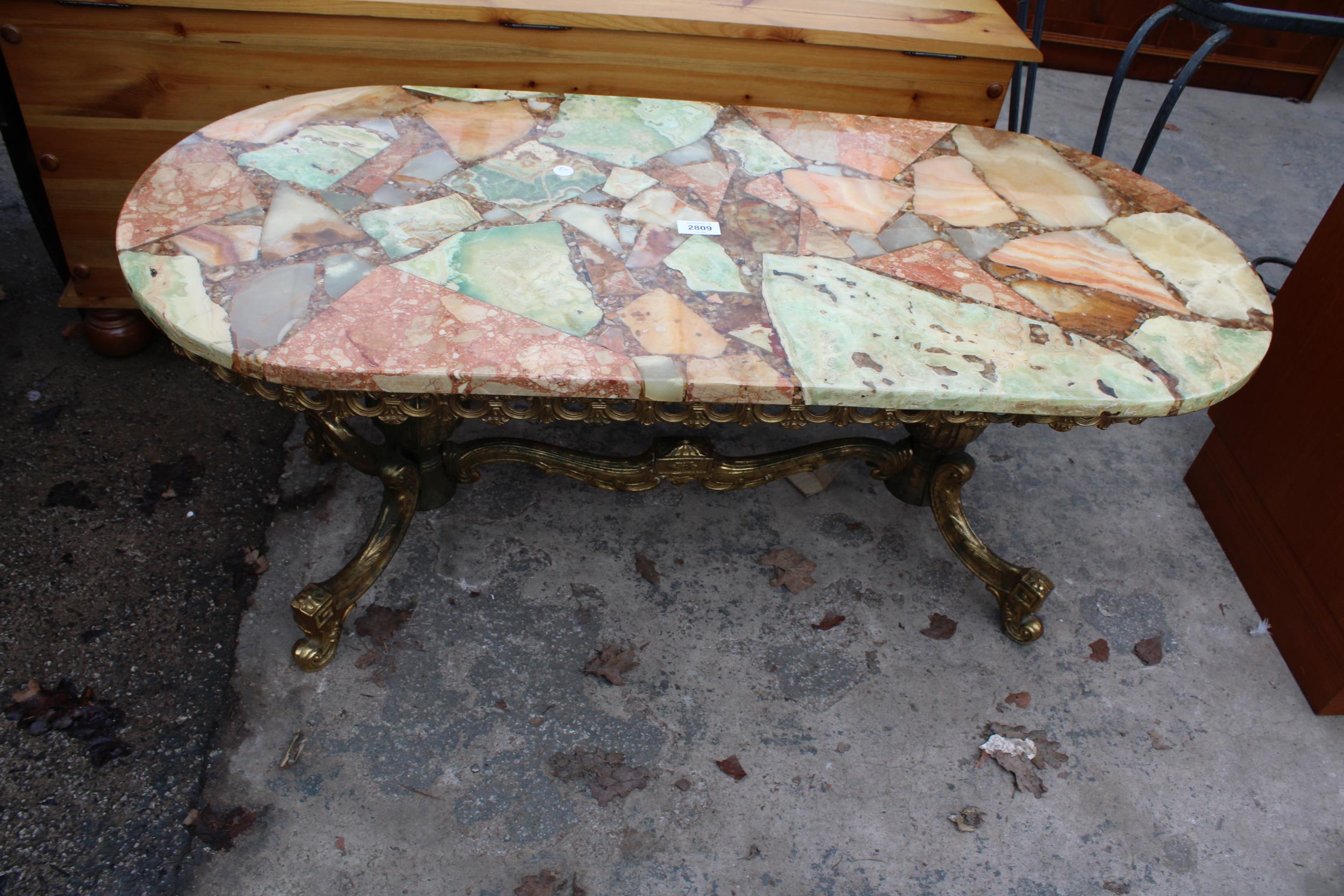 AN ONYX AND GILT TWIN PEDESTAL COFFEE TABLE 42" X 18"