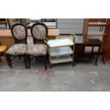 A THREE TIER TROLLEY, PAIR OF DINING CHAIRS AND A TWO TIER OCCASIONAL TABLE