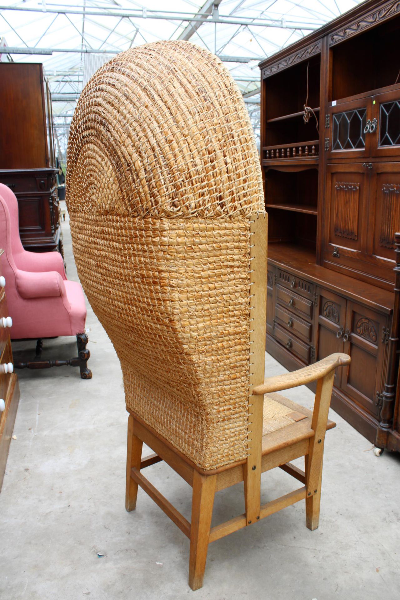 A HOODED OAK FRAMED ORKNEY CHAIR WITH WICKER SEAT AND STITCHED STRAW BACK, STAMPED D M KIRKNESS, - Image 2 of 4