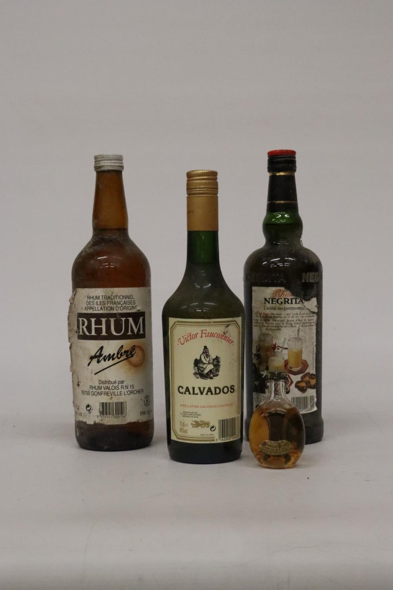 THREE 70CL BOTTLES OF LIQUEUR AND A MINIATURE BOTTLE OF WHISKY