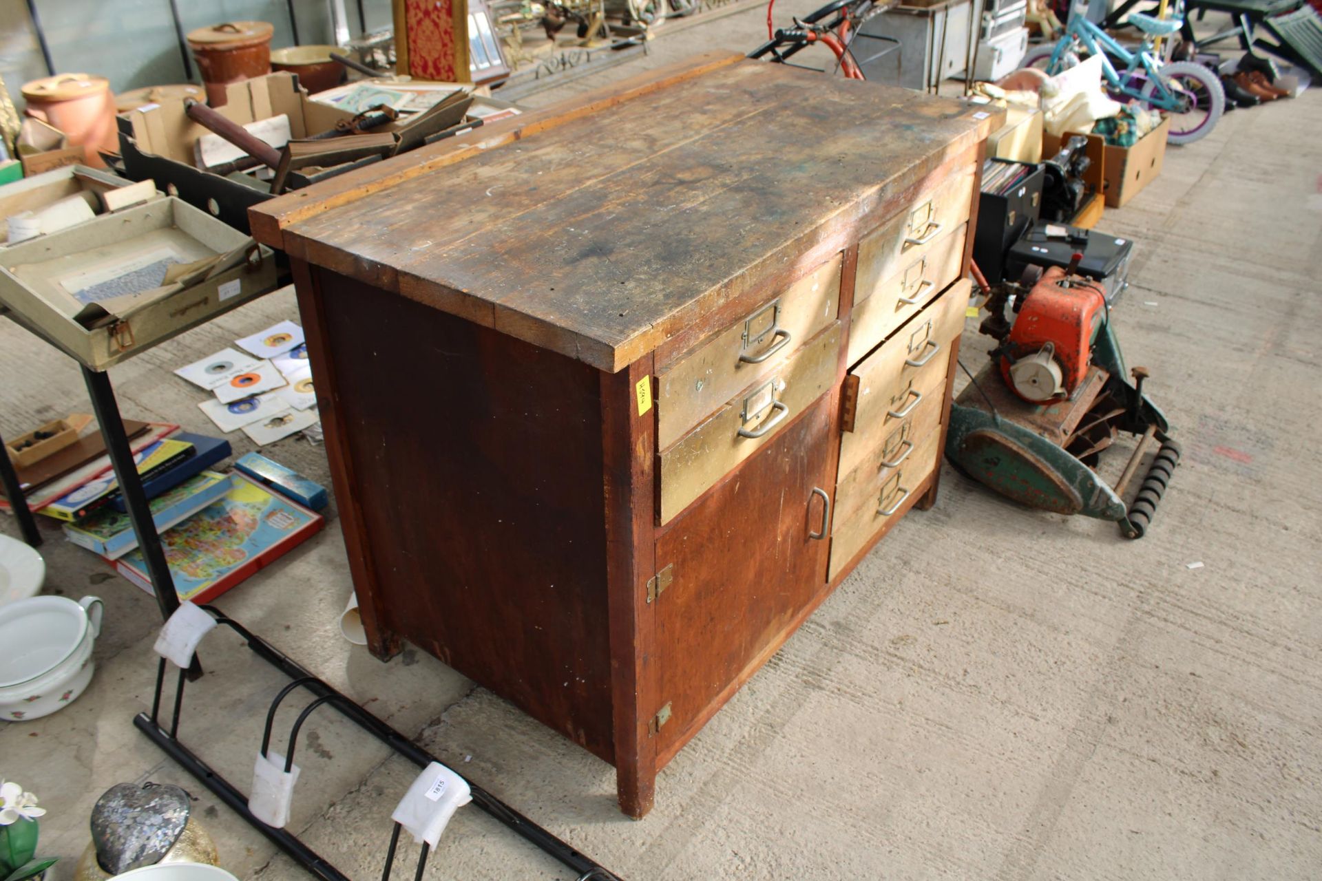 A VINTAGE WOODEN WORK BENCH WITH 8 DRAWERS AND A LOWER CUPBOARD (L:119CM) - Image 2 of 2