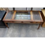 A MAHOGANY COFFEE/BIJOUTERIE TABLE WITH INSET LEATHER TOP AND TWO END DRAWERS 49" X 22"