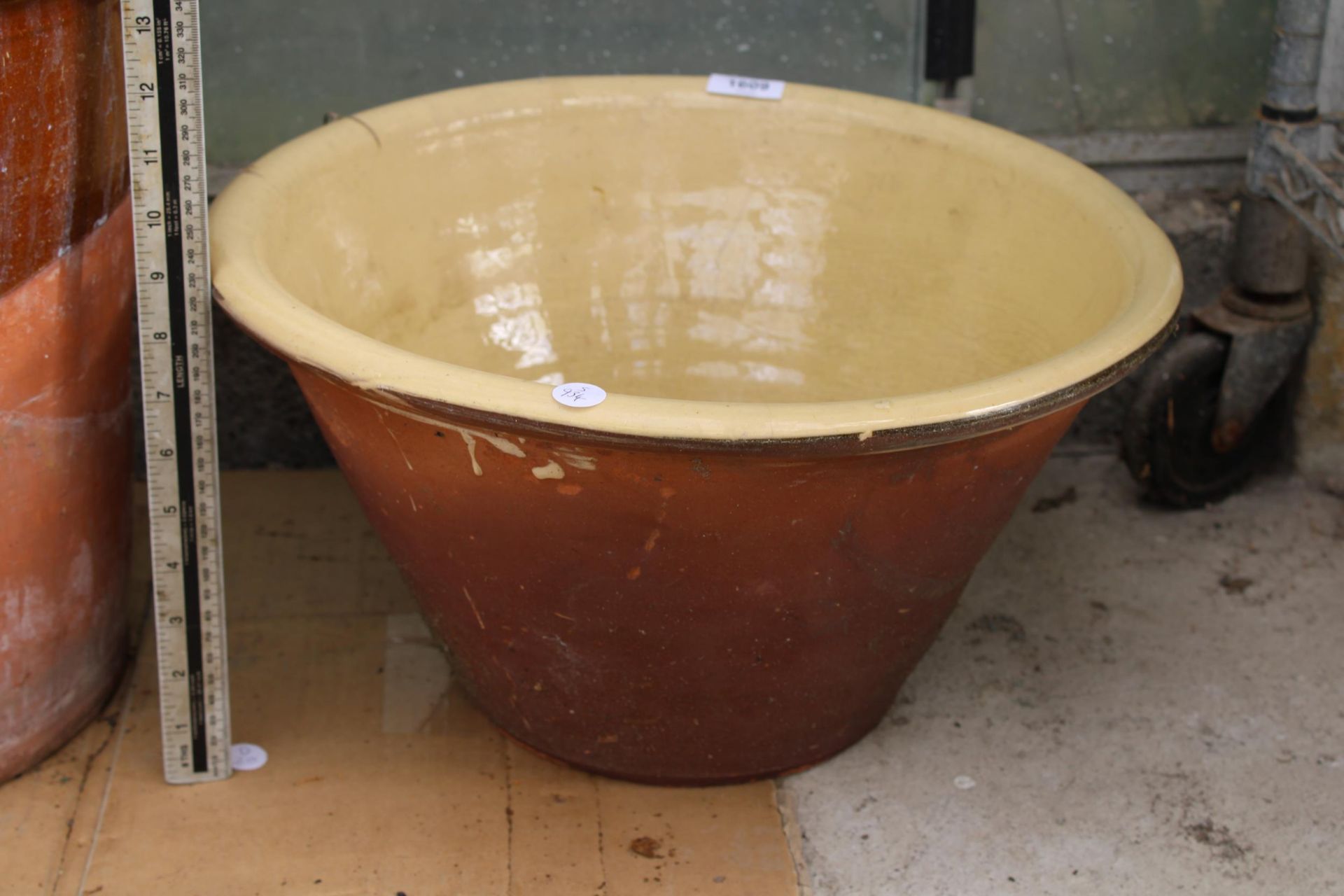 A GLAZED TERRACOTTA BOWL PLANTER