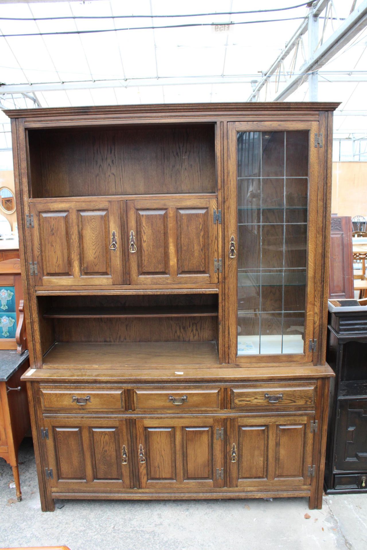 A WADE FURNITURE CABINET WITH THREE UPPER DOORS AND THREE DOORS AND THREE DRAWERS