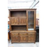 A WADE FURNITURE CABINET WITH THREE UPPER DOORS AND THREE DOORS AND THREE DRAWERS