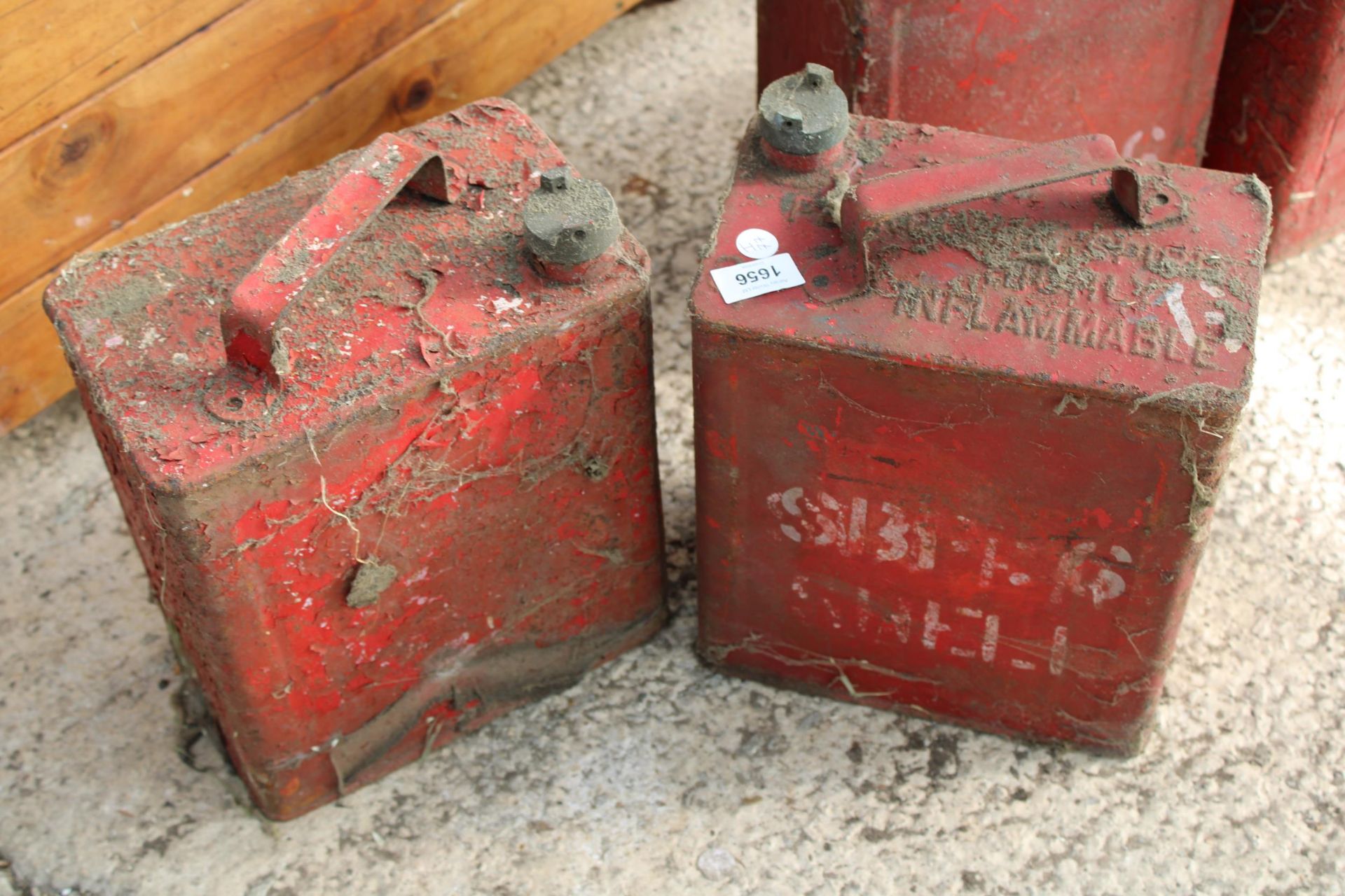 TWO VINTAGE METAL FUEL CANS WITH BRASS CAPS