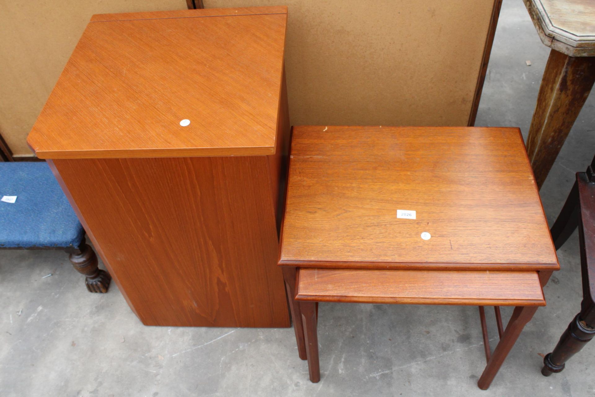 A RETRO TEAK NEST OF TWO TABLES AND STORAGE UNIT