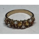 A 9 CARAT GOLD RING WITH FIVE CITRINE COLOURED STONES AND FOUR SEED PEARLS GROSS WEIGHT 2.85 GRAMS