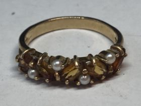 A 9 CARAT GOLD RING WITH FIVE CITRINE COLOURED STONES AND FOUR SEED PEARLS GROSS WEIGHT 2.85 GRAMS