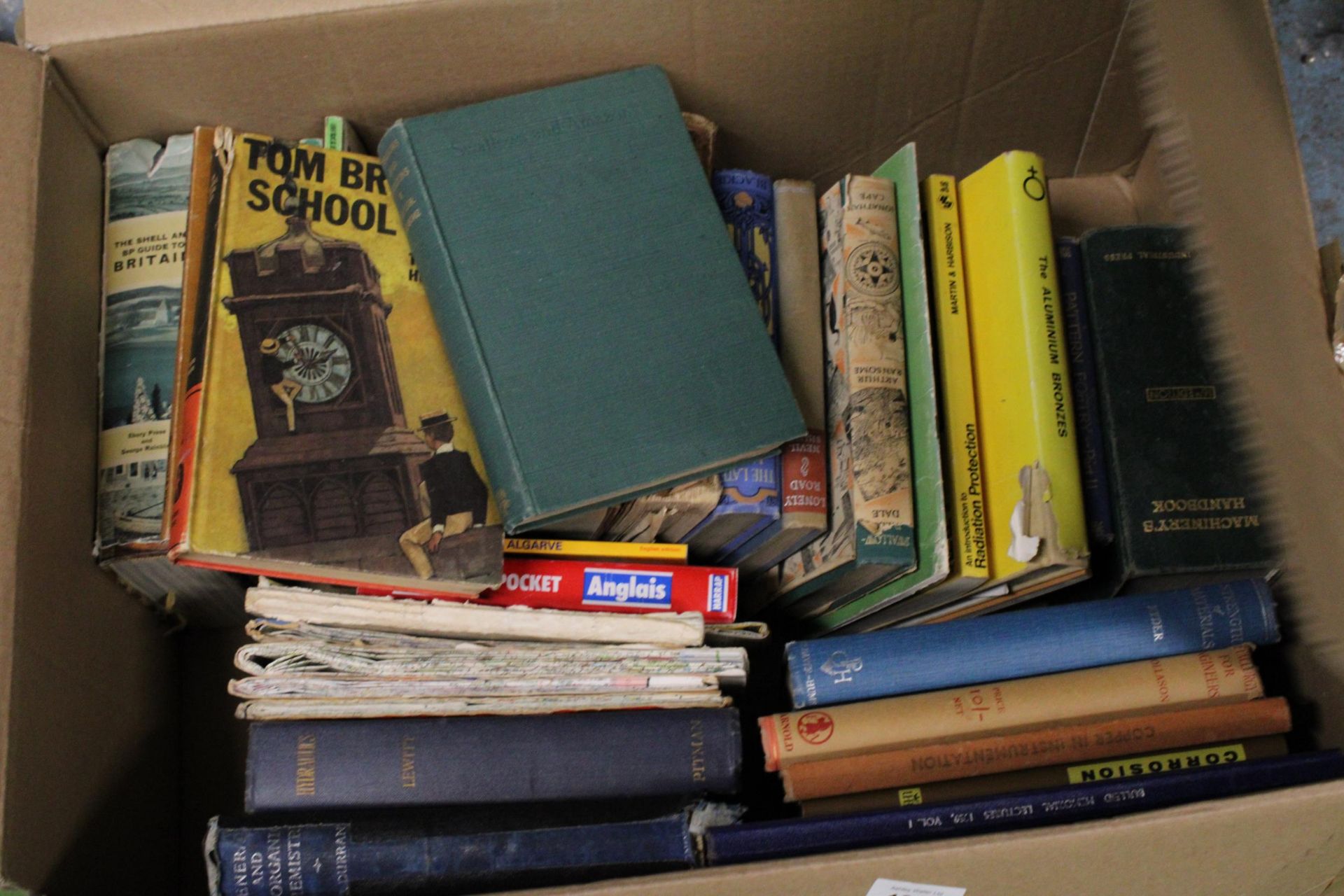 A LARGE QUANTITY OF BOOKS AND MAPS TO INCLUDE SWALLOWS AND AMAZONS, TOM BROWN'S SCHOOL DAYS ETC