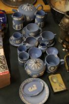 A COLLECTION OF POWDER BLUE WEDGWOOD JASPERWARE TO INCLUDE A TEAPOT, CUPS, SAUCERS, JUGS, BOWLS, ETC