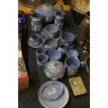 A COLLECTION OF POWDER BLUE WEDGWOOD JASPERWARE TO INCLUDE A TEAPOT, CUPS, SAUCERS, JUGS, BOWLS, ETC