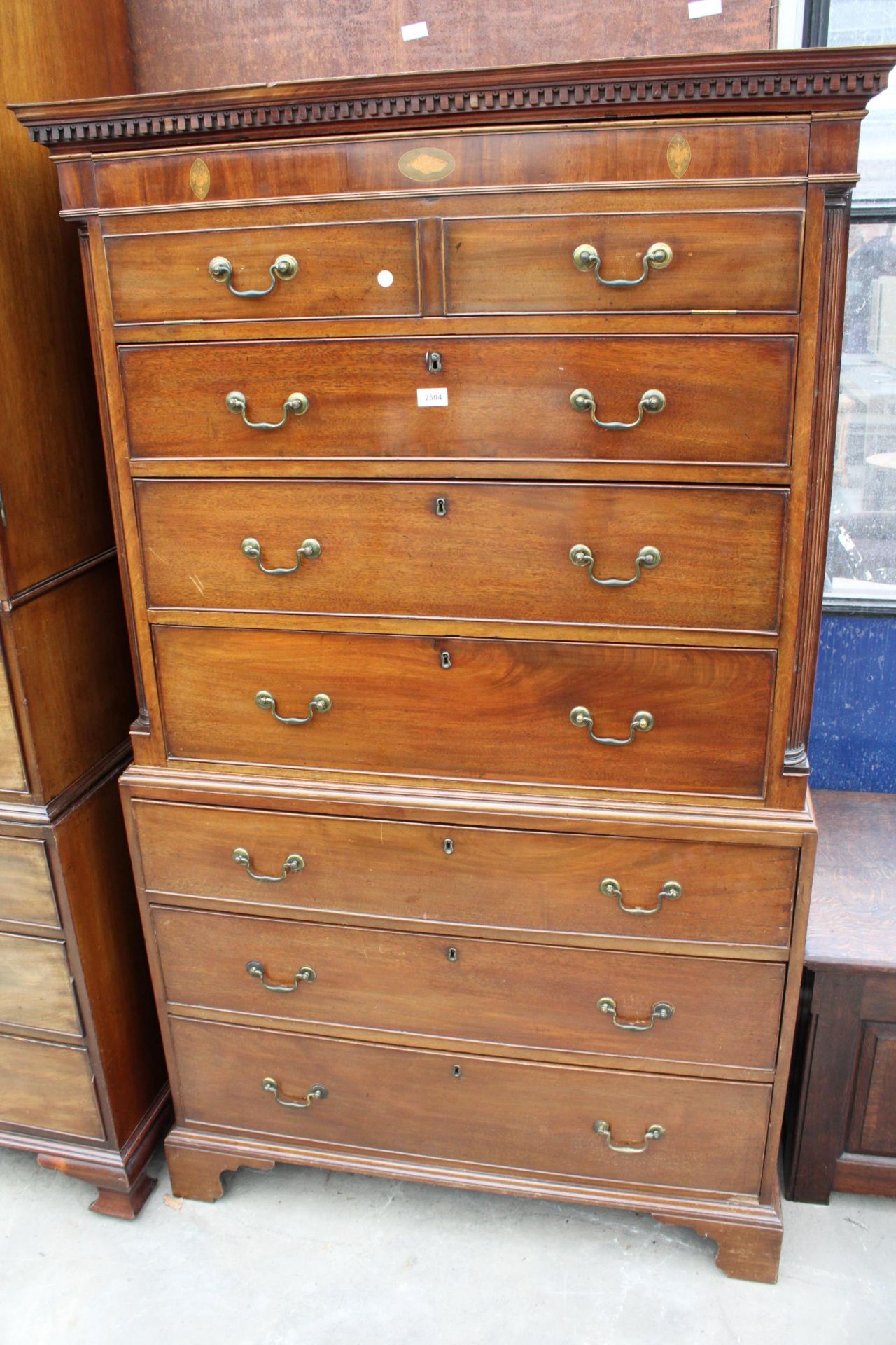 A 19TH CENTURY MAHOGANY AND INLAID CHEST ON CHEST WITH FOLD DOWN FLAP BEING TWO SHAM DRAWERS AND