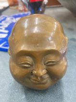 A BRASS FOUR FACED BUDDHA