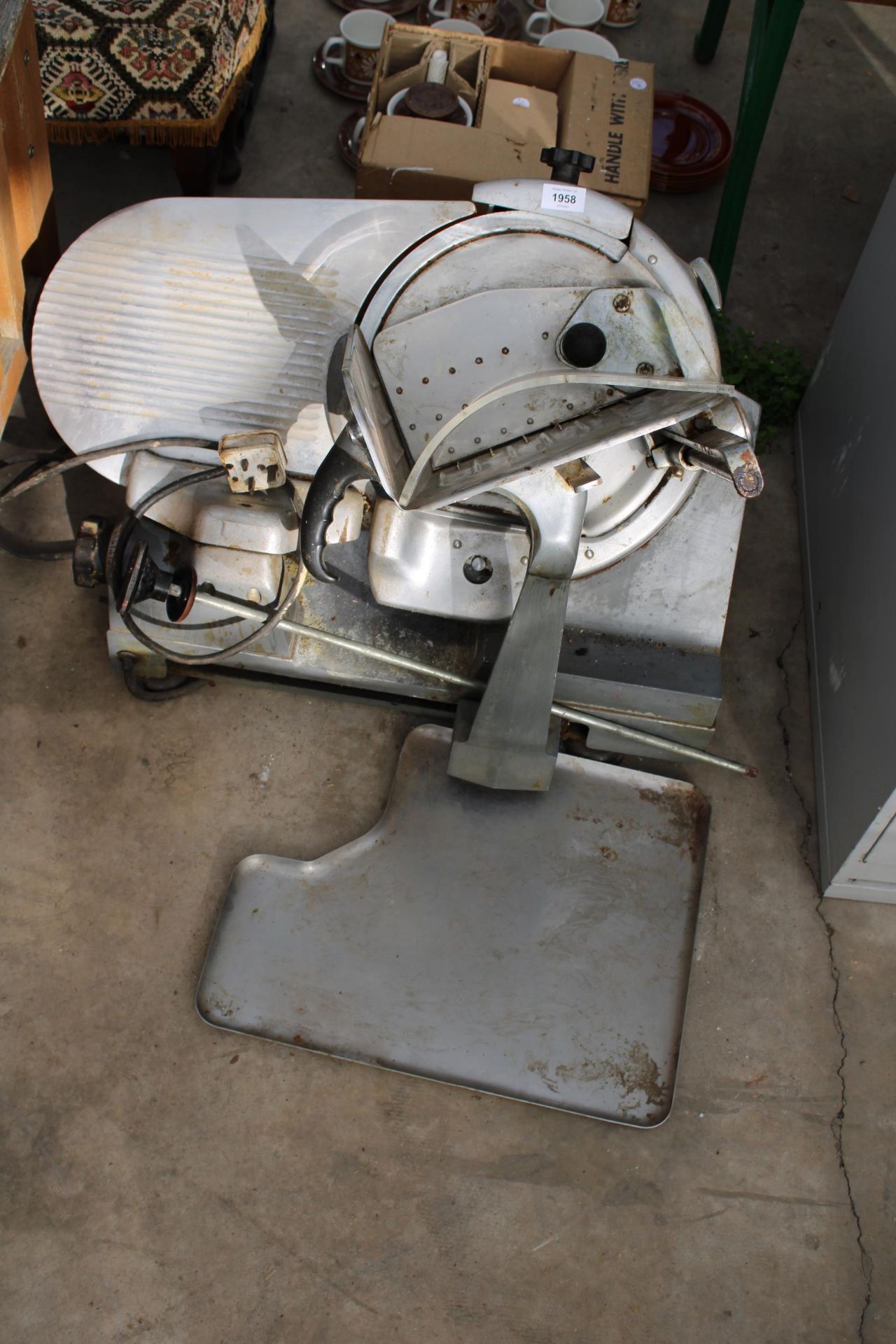 AN INDUSTRIAL STAINLESS STEL MEAT SLICER