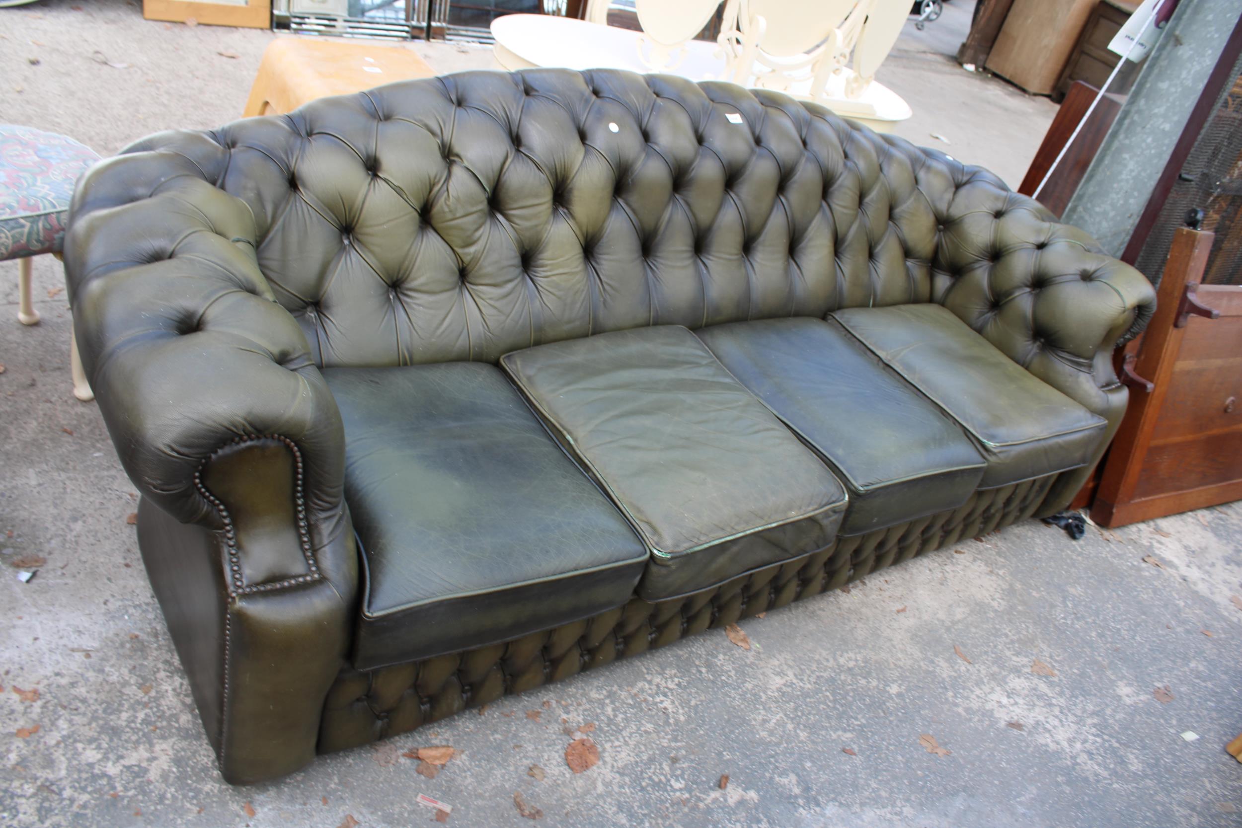 A GREEN LEATHER CHESTERFIELD FOUR SEATER SETTEE