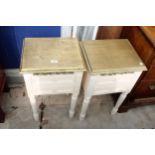 A PAIR OF CREAM AND GOLD PAINTED BEDSIDE TABLES
