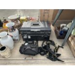 A LARGE PLASTIC TOOL BOX, TOOL BAGS AND A HARNESS ETC