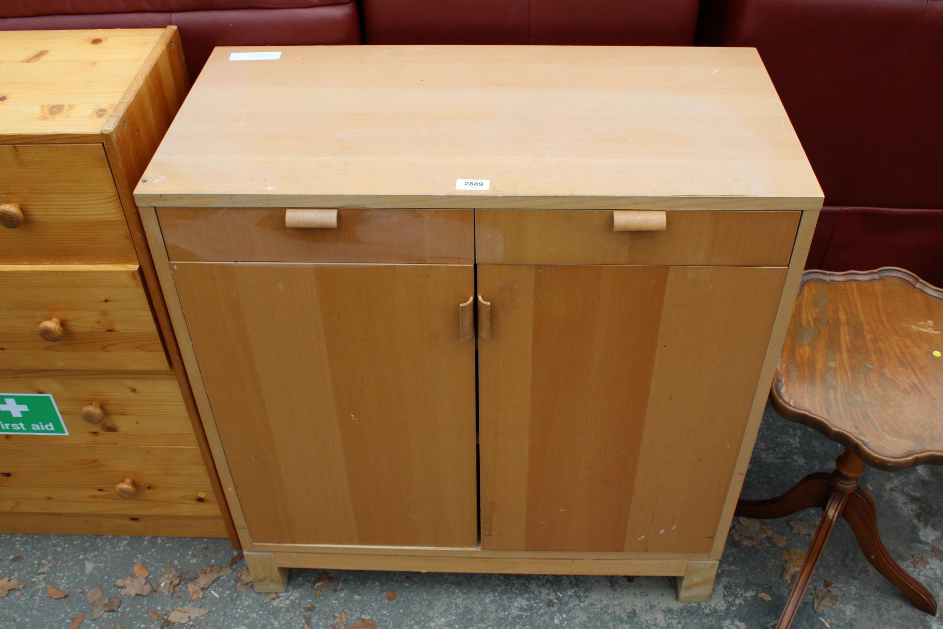 A HARDWOOD EFFECT CUPBOARD WITH BENTWOOD HANDLE 32" WIDE